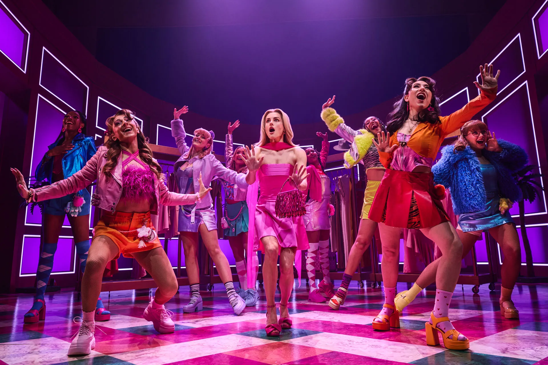 Amber Davies as Elle Woods and the Delta Nu sisters mid-number on the checkerboard stage in Legally Blonde The Musical