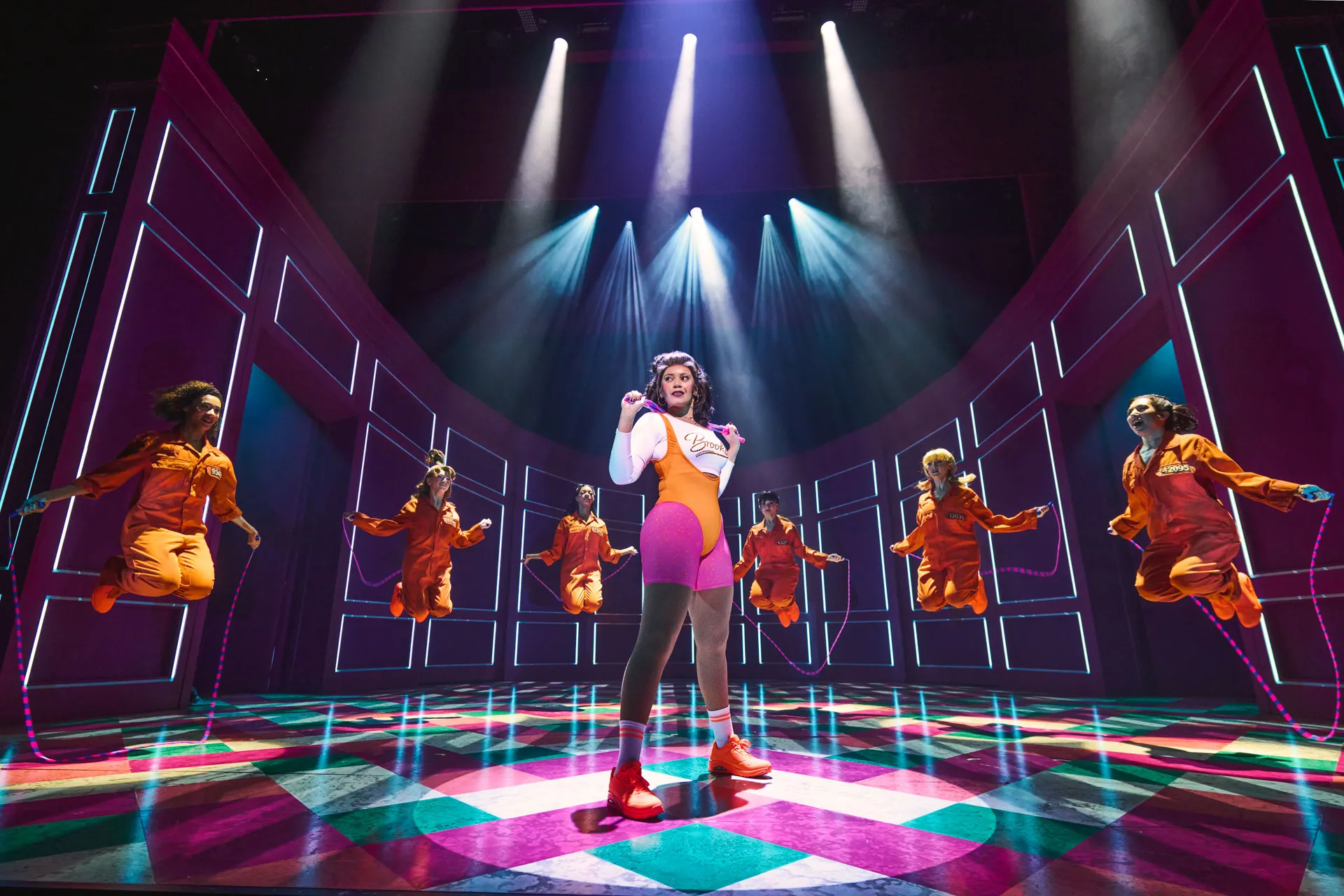 Jocasta Almgill as Brooke Wyndham leads a skipping-rope workout as inmates leap behind her in Legally Blonde The Musical